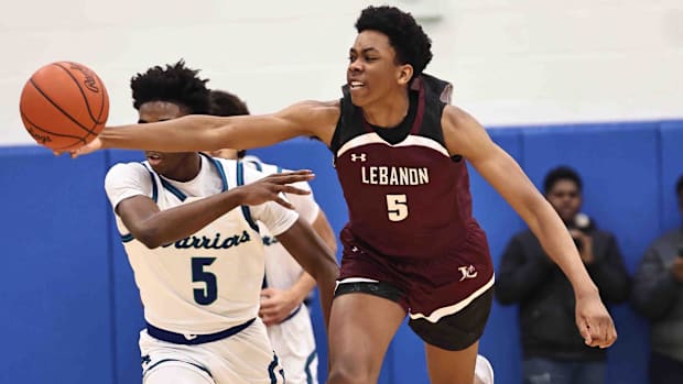 Lebanon forward Anthony Thompson (5) chases after a loose ball 