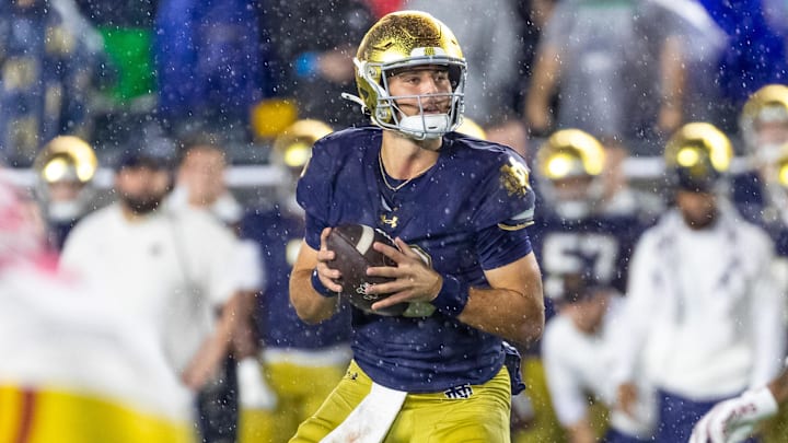 Oct 18, 2025; South Bend, Indiana, USA;  Notre Dame Fighting Irish quarterback CJ Carr (13) looks to pass against the Southern California Trojans during the second half at Notre Dame Stadium. Mandatory Credit: Michael Caterina-Imagn Images