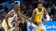 Oct 7, 2023; San Francisco, California, USA; Los Angeles Lakers guard D'Angelo Russell (1) passes past Golden State Warriors guard Chris Paul (3) during the first half at Chase Center. Mandatory Credit: John Hefti-Imagn Images