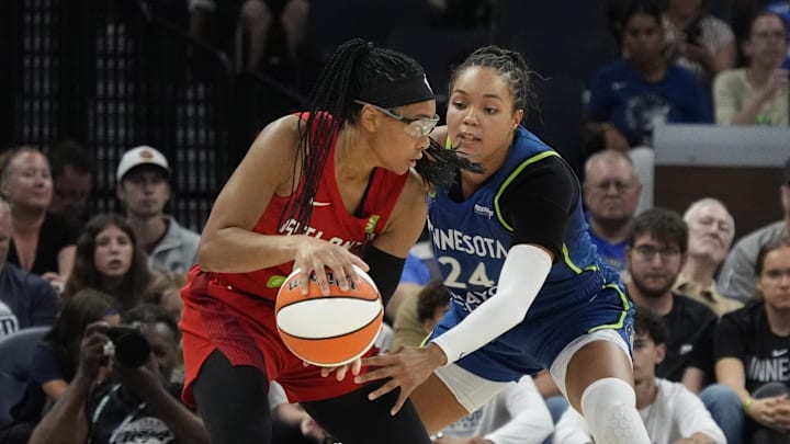 Jul 27, 2025; Minneapolis, Minnesota, USA; Minnesota Lynx forward Napheesa Collier (24) defends against Atlanta Dream guard Allisha Gray (15) in the third quarter at Target Center. Mandatory Credit: Bruce Kluckhohn-Imagn Images