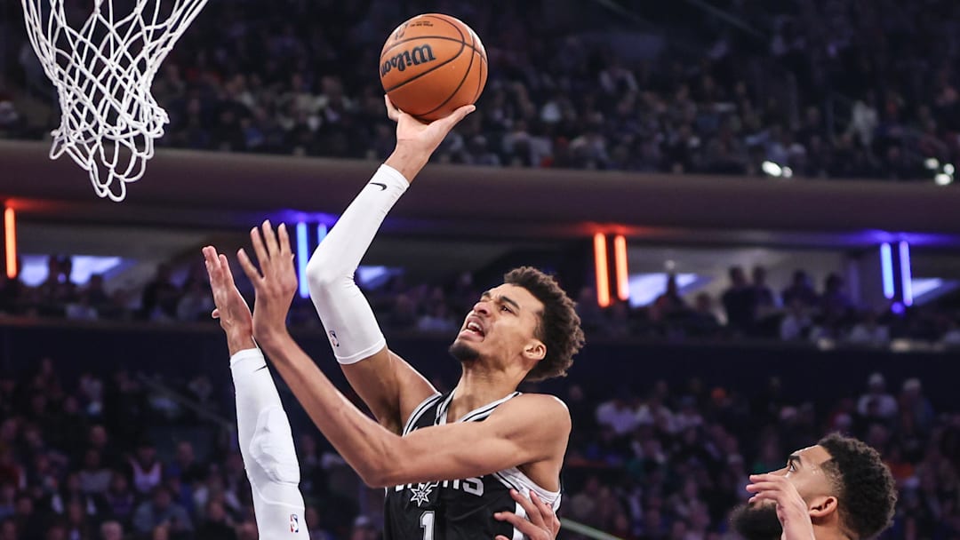 San Antonio Spurs center Victor Wembanyama (1) shoots over New York Knicks guard Josh Hart (3) in the first quarter at Madison Square Garden.
