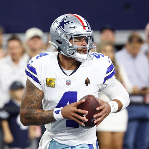Dallas Cowboys quarterback Dak Prescott warms up before the game against the Arizona Cardinals at AT&T Stadium.