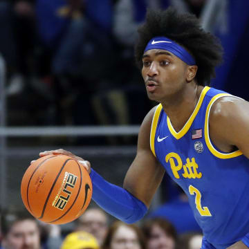 Feb 17, 2024; Pittsburgh, Pennsylvania, USA;  Pittsburgh Panthers forward Blake Hinson (2) dribbles the ball  against the Louisville Cardinals during the first half at the Petersen Events Center. Pittsburgh won 86-59. Mandatory Credit: Charles LeClaire-USA TODAY Sports