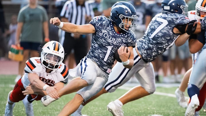 Manheim Township running back Declan Clancy slips out of an ankle tackle from Central York's Micah Bowers during a nonconference football game Thursday, August 29, 2024, in Neffsville, Lancaster County.