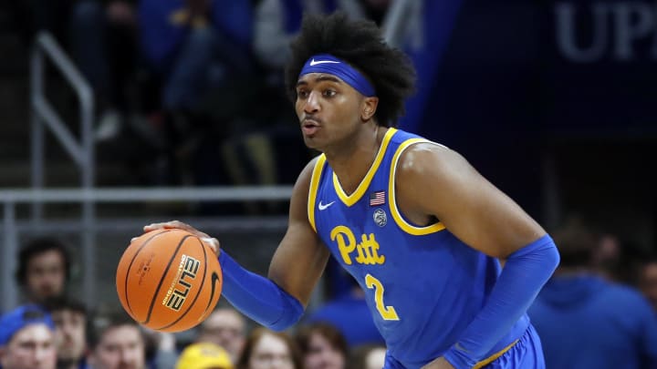 Feb 17, 2024; Pittsburgh, Pennsylvania, USA;  Pittsburgh Panthers forward Blake Hinson (2) dribbles the ball  against the Louisville Cardinals during the first half at the Petersen Events Center. Pittsburgh won 86-59. Mandatory Credit: Charles LeClaire-USA TODAY Sports