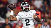 Sep 20, 2025; Los Angeles, California, USA; Michigan State Spartans quarterback Aidan Chiles (2) throws against the Southern California Trojans during the second half at the Los Angeles Memorial Coliseum.
