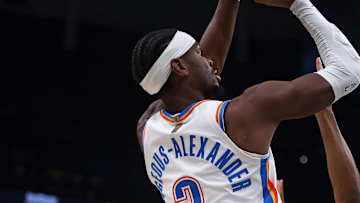 Nov 9, 2025; Memphis, Tennessee, USA; Oklahoma City Thunder guard Shai Gilgeous-Alexander (2) shoots as Memphis Grizzlies forward Jaylen Wells (0) defends during the first quarter at FedExForum. Mandatory Credit: Petre Thomas-Imagn Images