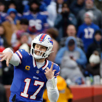 Buffalo Bills quarterback Josh Allen (17) steps into this throw over the middle. Allen only threw for 169 yards but scored 2 rushing touchdowns in a 27-21 win over New England.