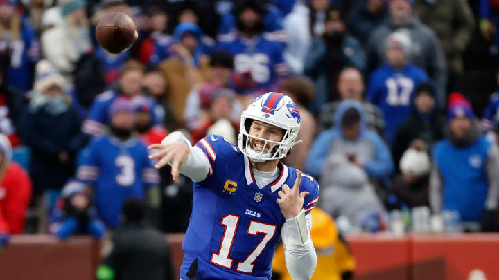 Buffalo Bills quarterback Josh Allen (17) steps into this throw over the middle. Allen only threw for 169 yards but scored 2 rushing touchdowns in a 27-21 win over New England.