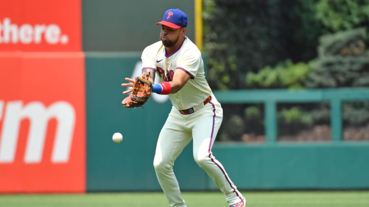 Jul 28, 2024; Philadelphia, Pennsylvania, USA; Philadelphia Phillies shortstop Edmundo Sosa loses sight of the ball.