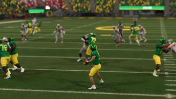 EA Sports College Football 25 gameplay action featuring Oregon Ducks Football in Autzen Stadium.