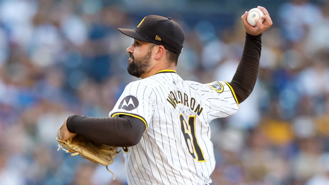 Jul 30, 2024; San Diego, California, USA; San Diego Padres starting pitcher Matt Waldron (61) throws a pitch during the first inning against the Los Angeles Dodgers at Petco Park. Mandatory Credit: David Frerker-USA TODAY Sports