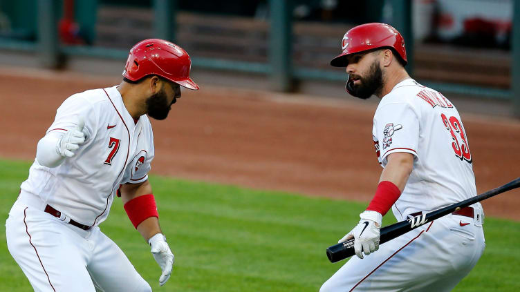 Cincinnati Reds third baseman Eugenio Suarez (7) and designated hitter Jesse Winker (33) celebrate.