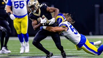 Dec 1, 2024; New Orleans, Louisiana, USA;  New Orleans Saints wide receiver Kevin Austin Jr. (81) is tackled by Los Angeles Rams linebacker Christian Rozeboom (56) during the first half at Caesars Superdome. Mandatory Credit: Stephen Lew-Imagn Images