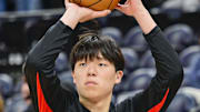 Oct 16, 2025; Salt Lake City, Utah, USA; Portland Trail Blazers center Yang Hansen (16) warms up before the game against the Utah Jazz at Delta Center. Mandatory Credit: Peter Creveling-Imagn Images