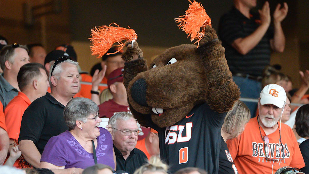 Jun 19, 2017; Omaha, NE, USA; The Oregon State Beavers mascot cheers with fans during the game against the LSU Tigers at TD Ameritrade Park Omaha. Mandatory Credit: Steven Branscombe-Imagn Images