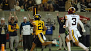Sep 13, 2025; Berkeley, California, USA; California Golden Bears wide receiver Jacob De Jesus (21) runs into the end zone with a touchdown reception in front of Minnesota Golden Gophers defensive back Koi Perich (3) during the first quarter at California Memorial Stadium. Mandatory Credit: D. Ross Cameron-Imagn Images
