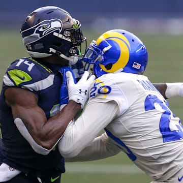 Dec 27, 2020; Seattle, Washington, USA; Los Angeles Rams cornerback Jalen Ramsey (20) covers Seattle Seahawks wide receiver DK Metcalf (14) during the second quarter at Lumen Field. Mandatory Credit: Joe Nicholson-Imagn Images