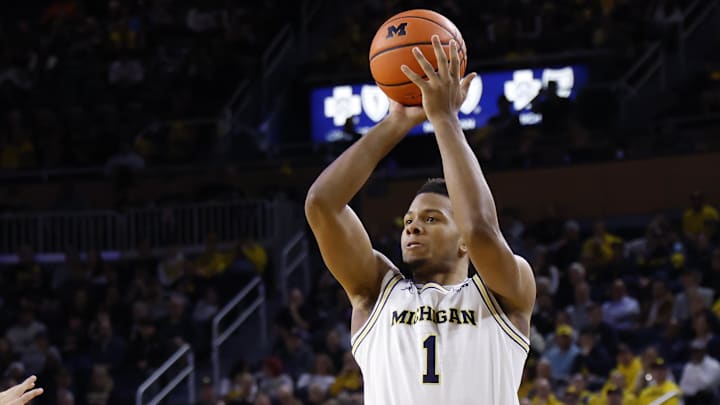 Feb 24, 2026; Ann Arbor, Michigan, USA; Michigan Wolverines guard Trey McKenney (1) shoots in the first half against the Minnesota Golden Gophers at Crisler Center. Mandatory Credit: Rick Osentoski-Imagn Images