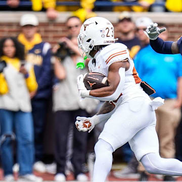 Michigan defensive back Will Johnson defends Texas running back Jaydon Blue during the first half at Michigan Stadium in Ann Arbor on Saturday, Sept. 7, 2024.