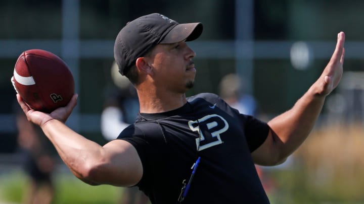 Purdue Boilermakers head coach Ryan Walters throws the ball 