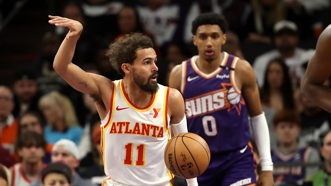 Jan 9, 2025; Phoenix, Arizona, USA; Atlanta Hawks guard Trae Young (11) celebrates a shot against the Phoenix Suns in the first half at Footprint Center. Mandatory Credit: Mark J. Rebilas-Imagn Images Jan 9, 2025; Phoenix, Arizona, USA; Atlanta Hawks guard Trae Young (11) celebrates a shot against the Phoenix Suns in the first half at Footprint Center. Mandatory Credit: Mark J. Rebilas-Imagn Images