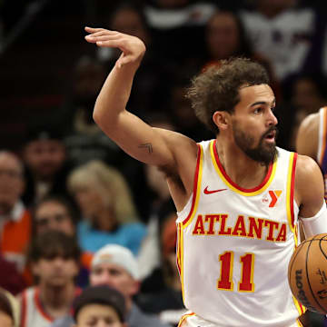Jan 9, 2025; Phoenix, Arizona, USA; Atlanta Hawks guard Trae Young (11) celebrates a shot against the Phoenix Suns in the first half at Footprint Center. Mandatory Credit: Mark J. Rebilas-Imagn Images