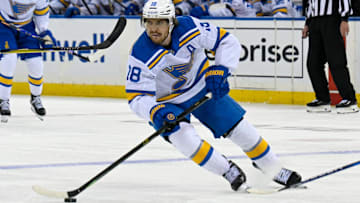 Nov 24, 2025; New York, New York, USA; St. Louis Blues center Robert Thomas (18) skates with the puck against the New York Rangers during the third period at Madison Square Garden. Mandatory Credit: Dennis Schneidler-Imagn Images