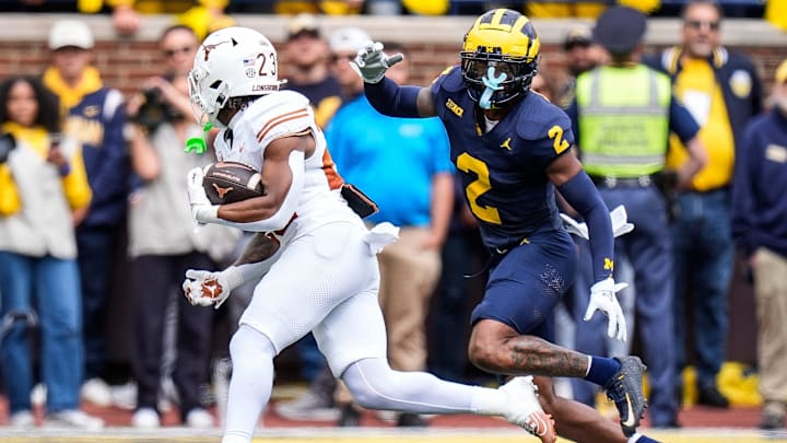 Michigan defensive back Will Johnson (2) defends Texas running back Jaydon Blue (23) during the first half at Michigan Stadium in Ann Arbor on Saturday, September 7, 2024.