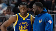 October 30, 2021; San Francisco, California, USA; Golden State Warriors forward Jonathan Kuminga (00) listens to forward Draymond Green (23) during the fourth quarter against the Oklahoma City Thunder at Chase Center. Mandatory Credit: Kyle Terada-Imagn Images