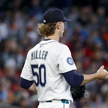 Seattle Mariners starting pitcher Bryce Miller (50) walks around the mound after surrendering a two-run home run to Minnesota Twins right fielder Matt Wallner (38, background) during the second inning at T-Mobile Park on March 31. 