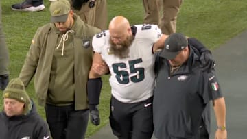 Philadelphia Eagles offensive tackle Lane Johnson limps from the field after suffering an ankle injury against the Green Bay Packers.