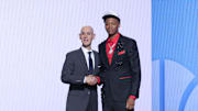 Jun 25, 2025; Brooklyn, NY, USA;  Ace Bailey stands with NBA commissioner Adam Silver after being selected as the fifth pick by the Utah Jazz in the first round of the 2025 NBA Draft at Barclays Center. Mandatory Credit: Brad Penner-Imagn Images