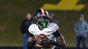 Belleville's Bryce Underwood rolls out to pass during a loss to Howell Friday, Oct. 25, 2024.