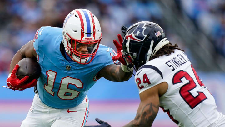 Tennessee Titans wide receiver Treylon Burks (16) stiff arms Houston Texans cornerback Derek Stingley Jr. (24) during the fourth quarter at Nissan Stadium in Nashville, Tenn., Sunday, Dec. 17, 2023.