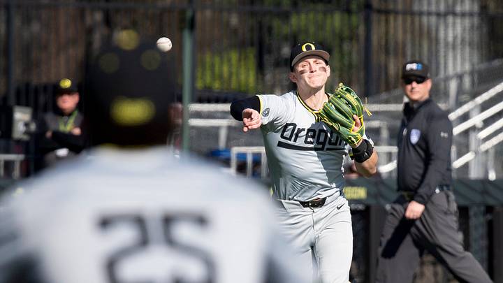 Oregon infielder Drew Smith throws to first for an out as the Oregon Ducks host Lafayette at PK Park in Eugene, Ore.
