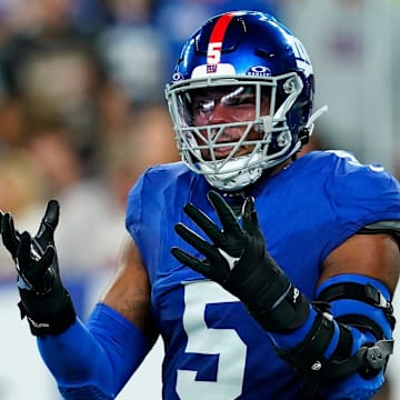 New York Giants linebacker Kayvon Thibodeaux reacts to nearly intercepting Seattle Seahawks quarterback Geno Smith in the first half at MetLife Stadium.