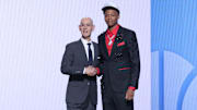 Jun 25, 2025; Brooklyn, NY, USA;  Ace Bailey stands with NBA commissioner Adam Silver after being selected as the fifth pick by the Utah Jazz in the first round of the 2025 NBA Draft at Barclays Center. Mandatory Credit: Brad Penner-Imagn Images