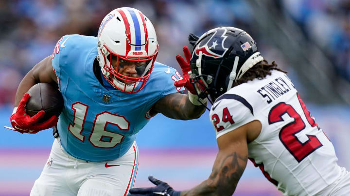 Tennessee Titans wide receiver Treylon Burks (16) stiff arms Houston Texans cornerback Derek Stingley Jr. (24) during the fourth quarter at Nissan Stadium in Nashville, Tenn., Sunday, Dec. 17, 2023