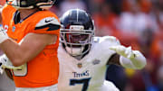 Tennessee Titans linebacker Femi Oladejo tries to tackle Denver Broncos quarterback Bo Nix.