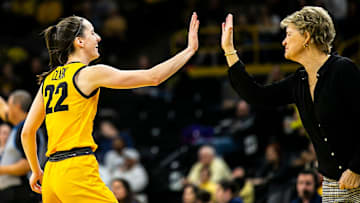 Iowa guard Caitlin Clark, left, high-fives head coach Lisa Bluder during a NCAA Big Ten Conference women's basketball game against Penn State, Saturday, Jan. 14, 2023, at Carver-Hawkeye Arena in Iowa City, Iowa.