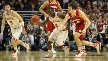 Indiana Hoosiers guard Victor Oladipo (4) brings the ball up court against Wisconsin Badgers forward Frank Kaminsky (44) in the first half during the semifinals of the Big Ten tournament at the United Center. Mandatory Credit: David Banks-USA TODAY Sports