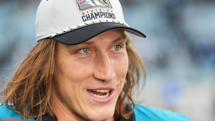 Jacksonville Jaguars quarterback Trevor Lawrence (16) proudly wears his AFC South Division Champions hat during the fourth quarter in an NFL football matchup at EverBank Stadium, Sunday, Jan. 4, 2026, in Jacksonville, Fla. The Jaguars defeated the Titans 41-7 [Doug Engle/Florida Times-Union]