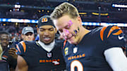 Dec 9, 2024; Arlington, Texas, USA;  Cincinnati Bengals wide receiver Ja'Marr Chase (1) smashes a donut on the face of Cincinnati Bengals quarterback Joe Burrow (9) after the game against the Dallas Cowboys at AT&T Stadium. Mandatory Credit: Kevin Jairaj-Imagn Images