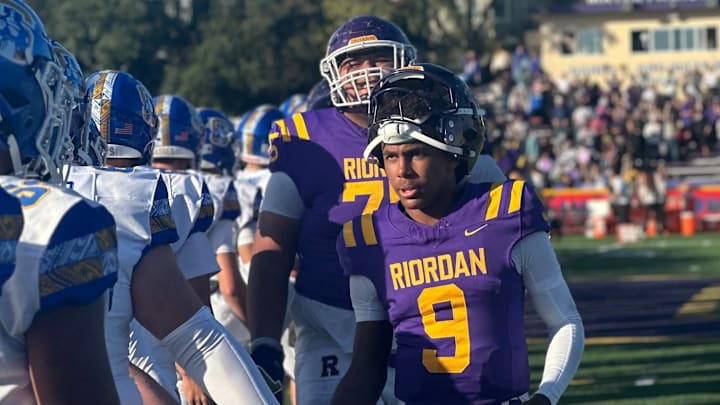 Riordan junior quarterback Mike Mitchell leads the handshake line after a stirring 27-21 home win over Serra in 2024; Riordan will face Serra again next week with the West Catholic Athletic League title on the line after beating Mitty 37-7 on Saturday. 