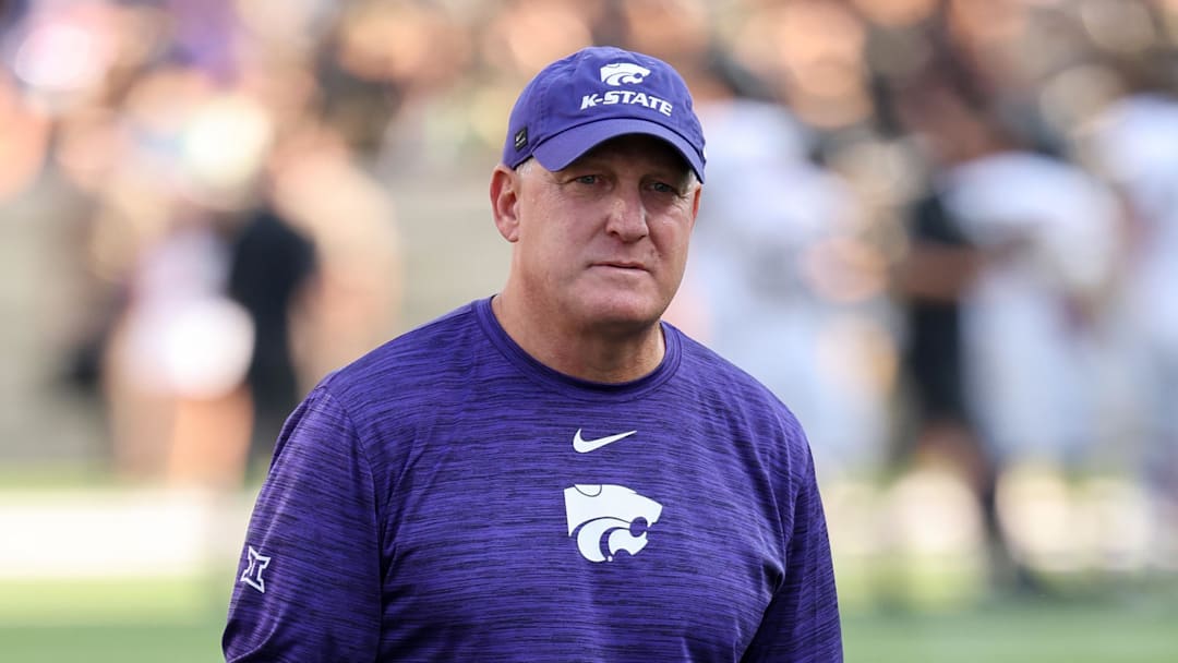 Sep 6, 2025; Manhattan, Kansas, USA; Kansas State Wildcats head coach Chris Klieman walks off the field after warmups before the start of a game against the Army Black Knights at Bill Snyder Family Football Stadium. 