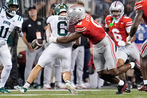 Ohio State Buckeyes linebacker Sonny Styles forces a fumble by Ohio Bobcats running back Duncan Brune.