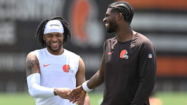 Jun 10, 2025; Berea, OH, USA; Cleveland Browns quarterback Shedeur Sanders (12) and wide receiver Gage Larvadain (84) walk of