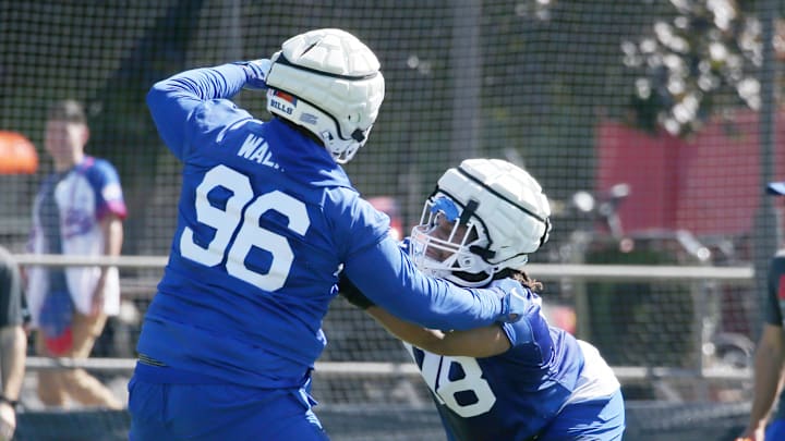 defensive linemen T.J. Sanders and Deone Walker during practice at training camp
