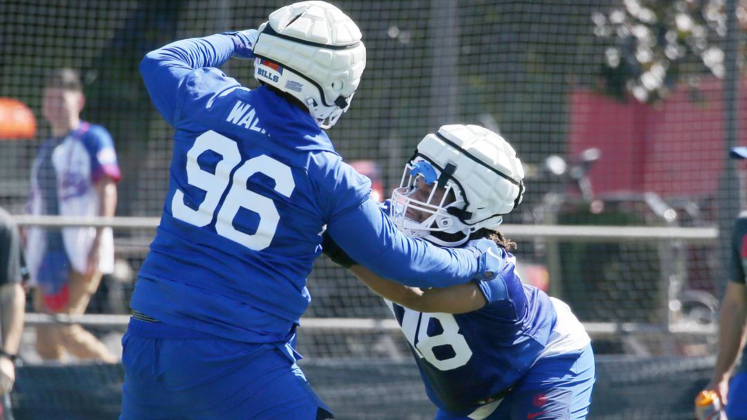 Buffalo Bills defensive tackles T.J. Sanders (right) and Deone Walker (left) lock up with each other during positional drills during the opening day of Buffalo's training camp practice at St. John Fisher University on Wednesday, July 23, 2025, in Pittsford, New York.